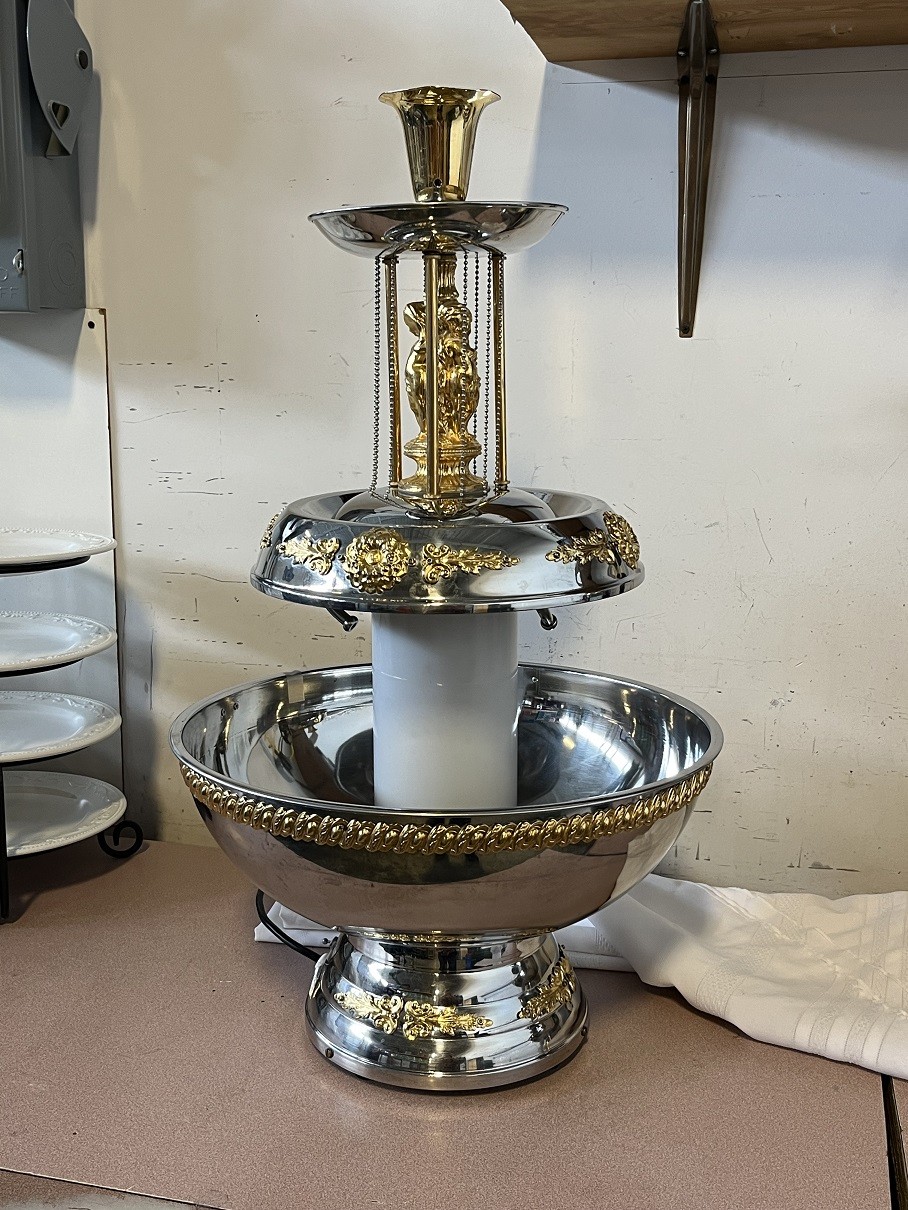 https://www.atozpartyrental.net/wp-content/uploads/2023/01/3-tier-beverage-fountain-for-sale-silver-and-gold-1.jpg