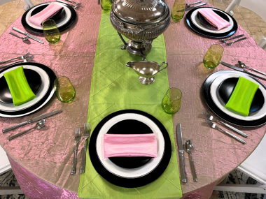 Full tablescape of Elphaba and Glinda Wicked themed design in evil emerald green and popular pink